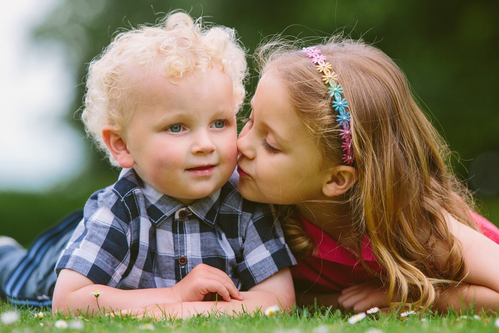 Location Portrait Shoot little girl kissing her little brother