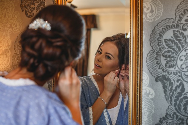 Stan-Seaton-photographyl-Bride-with-bride-Putting-in-earrings