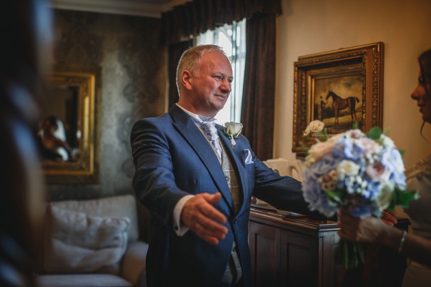 Stan-Seaton-photography-bride-getting-ready-greeting-father