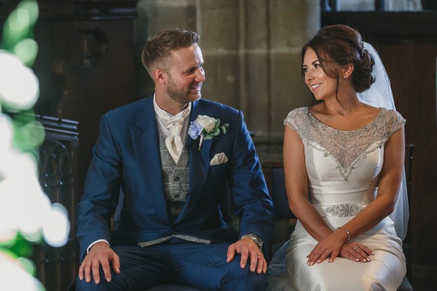 Stan-Seaton-Photography-bride-and-groom-listening-to-the-vicar