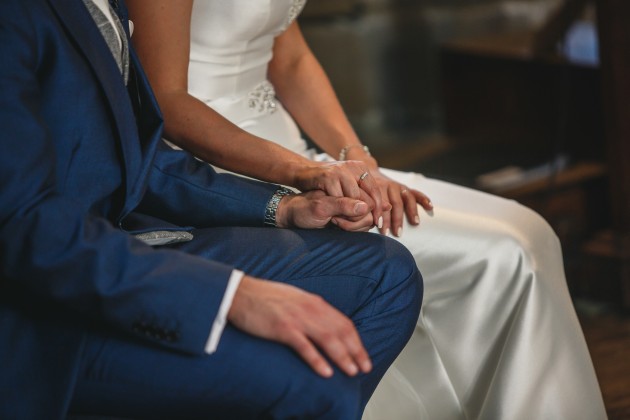 Stan-Seaton-Photography-bride-and-groom-listening-to-the-vicar