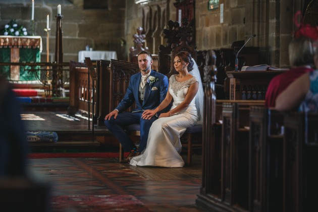 Stan-Seaton-Photography-bride-and-groom-listening-to-the-vicar