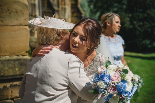 Stan-Seaton-Photography-bride-and-groom-greeting-guests