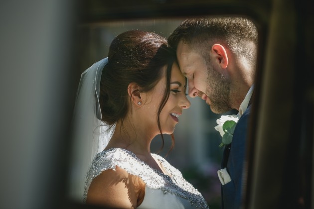 tan-Seaton-Photography-Headlam-Hall-Bride-and-groom-with-the-wedding-car