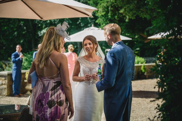 tan-Seaton-Photography-Headlam-Hall-bride-and-groom-talking-to-guests