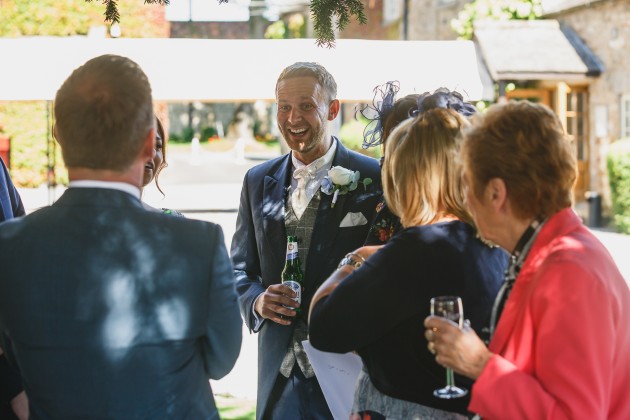 Stan-Seaton-Photography-Headlam-Hall-wedding-guests-chatting