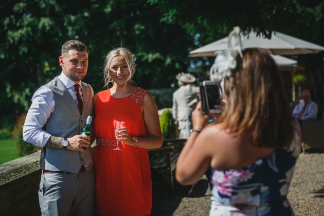 Stan-Seaton-Photography-Headlam-Hall-wedding-guests-chatting