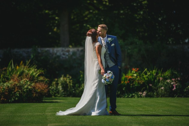 Stan-Seaton-Photography-Headlam-Hall-wedding-bride-and-groom-walking-on-the-lawn