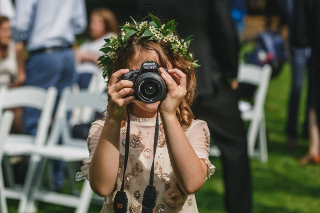 045 Durham-Castle-Wedding-Photographer-Stan-Seaton-flower-girl-taking-a-photograph.JPG