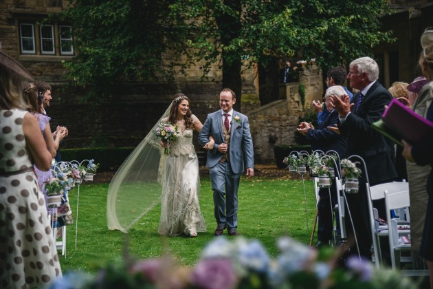 047 Durham-Castle-Wedding-Photographer-Stan-Seaton-bride-and-groom-walking-down-the-aisle.JPG