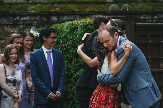 048 Durham-Castle-Wedding-Photographer-Stan-Seaton-bride-and-groom-greeting-guests.JPG