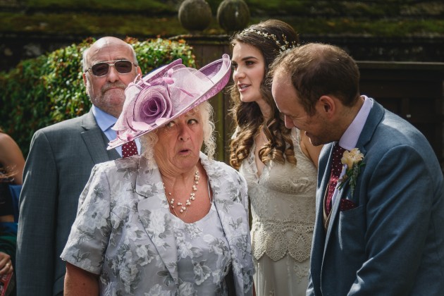 051 Durham-Castle-Wedding-Photographer-Stan-Seaton-guest-talking-to-the-groom.JPG